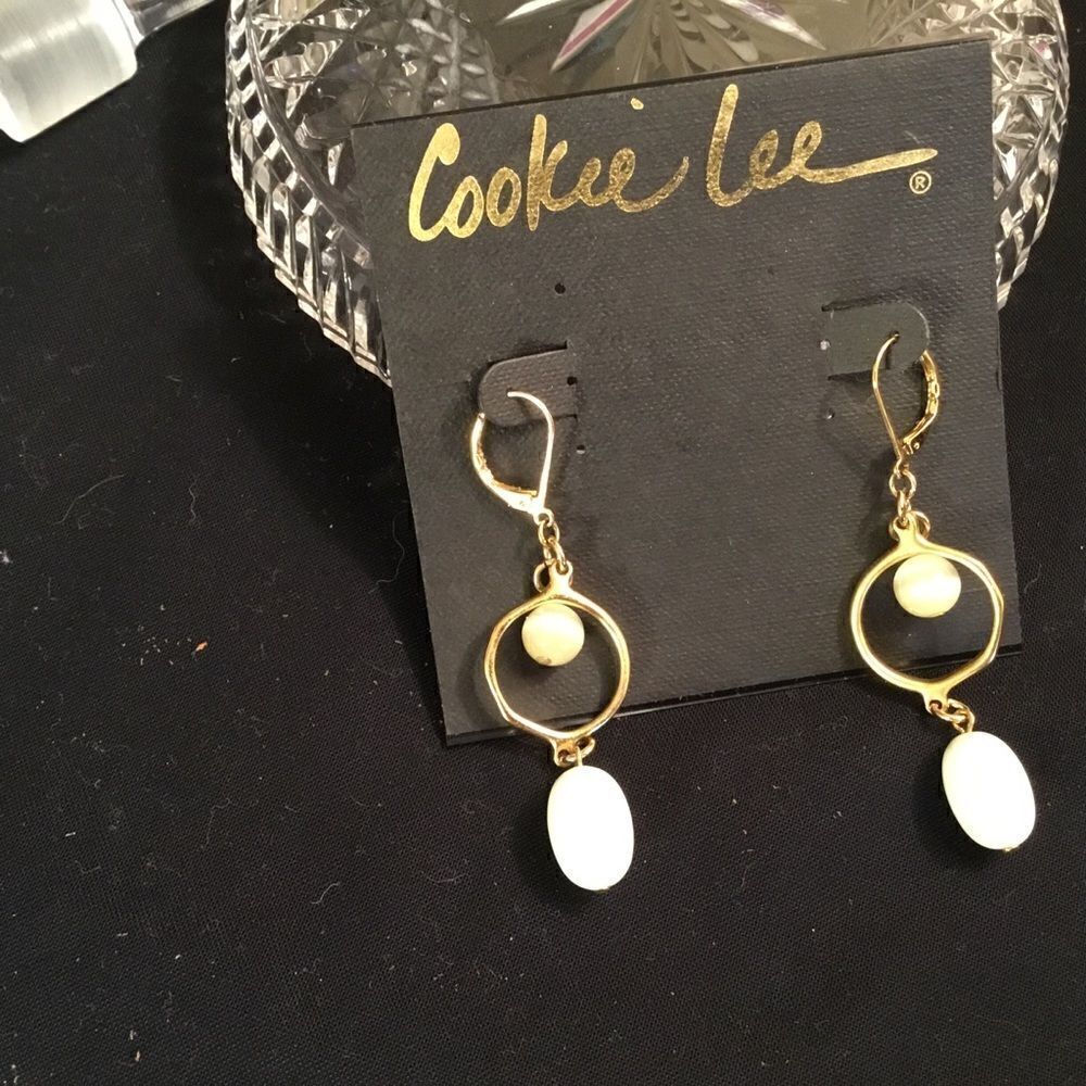 NWT. Cookie Lee Goldtone White Leverback Earrings